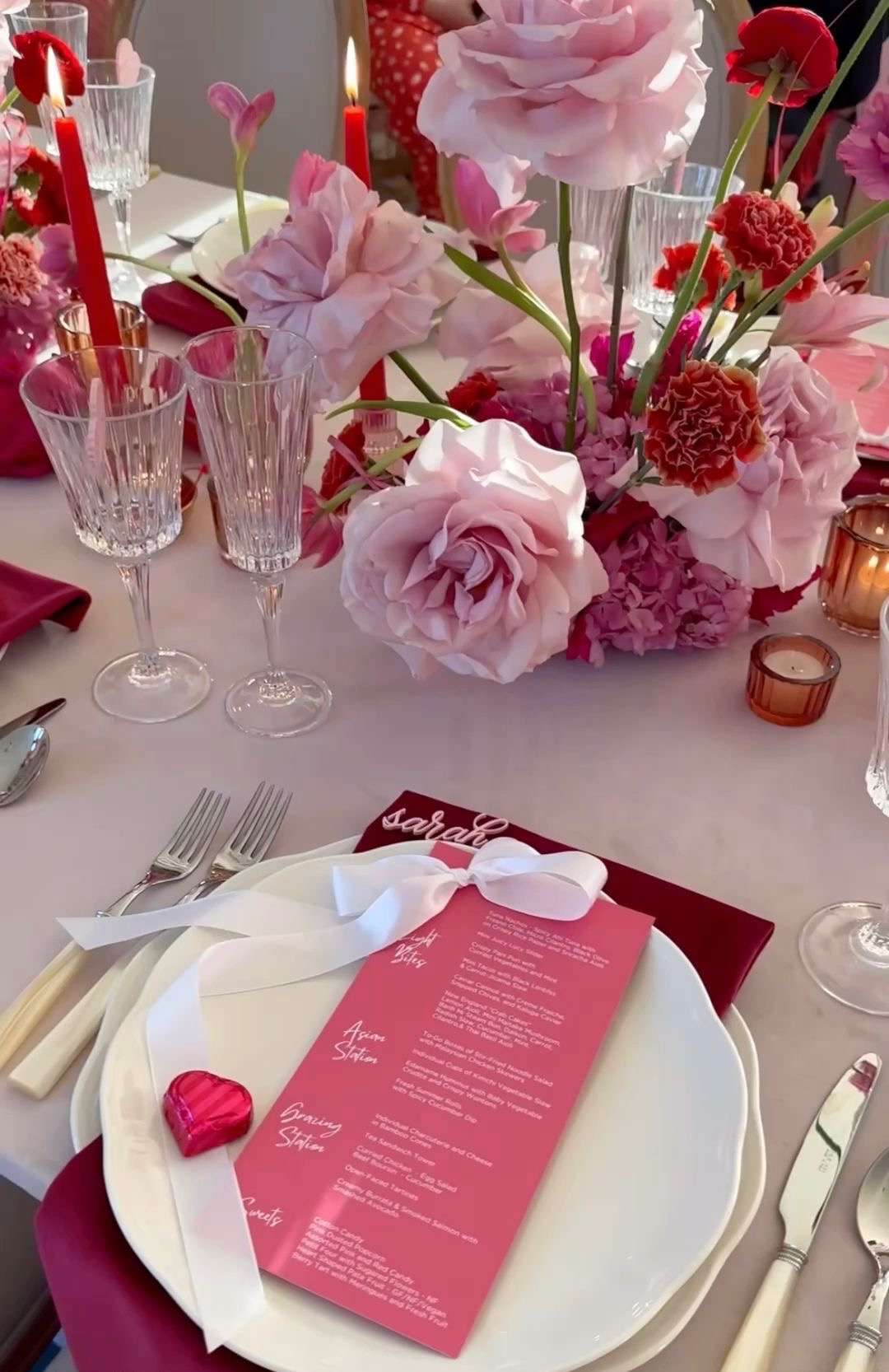 Hands carefully arranging flowers for a luxury event